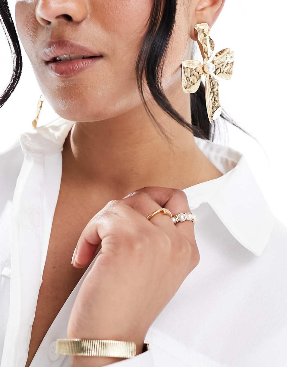ASOS DESIGN oversized stud earrings with hammered floral design in gold tone
