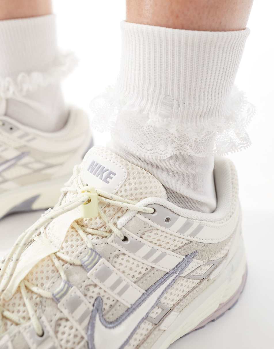 Nike P-6000 sneakers in off white with metallic detail