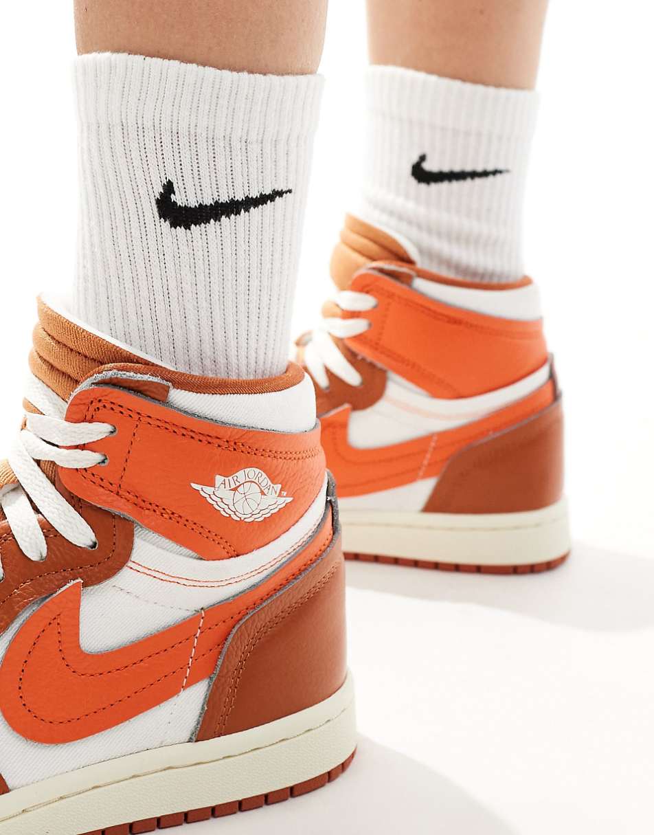 Nike Air Jordan 1 high sneakers in white and orange