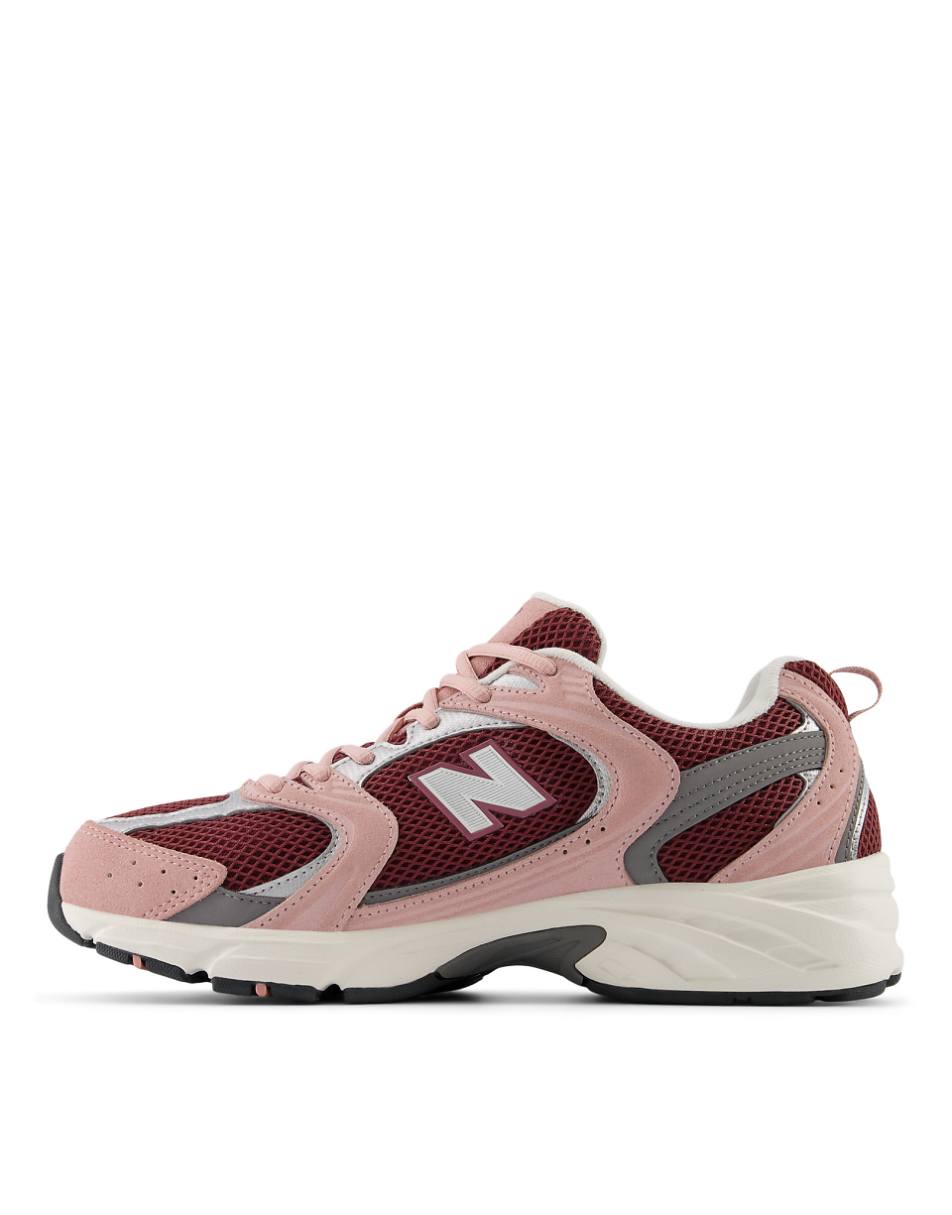 New Balance 530 sneakers in red with pink and silver details