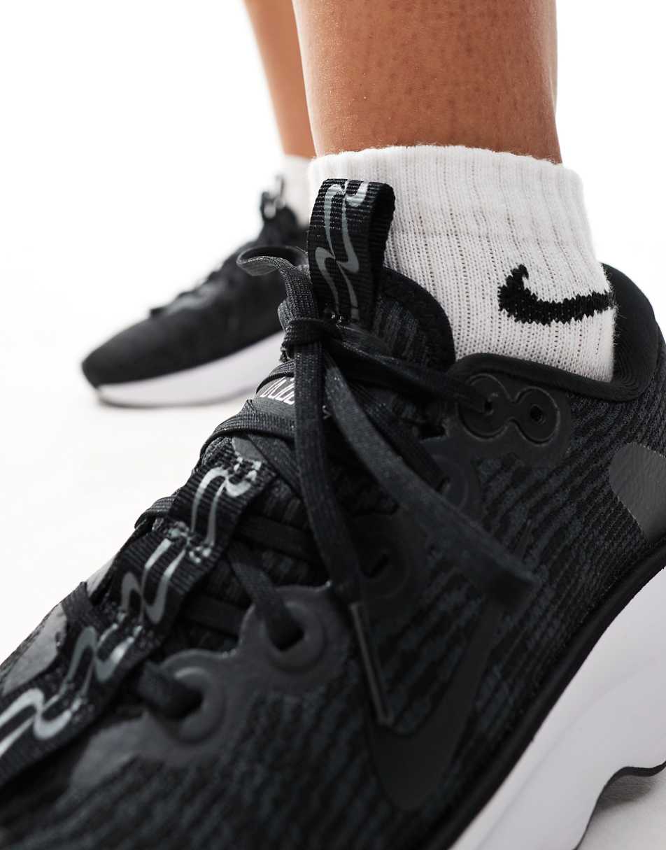 Nike Training Motiva sneakers in black and white
