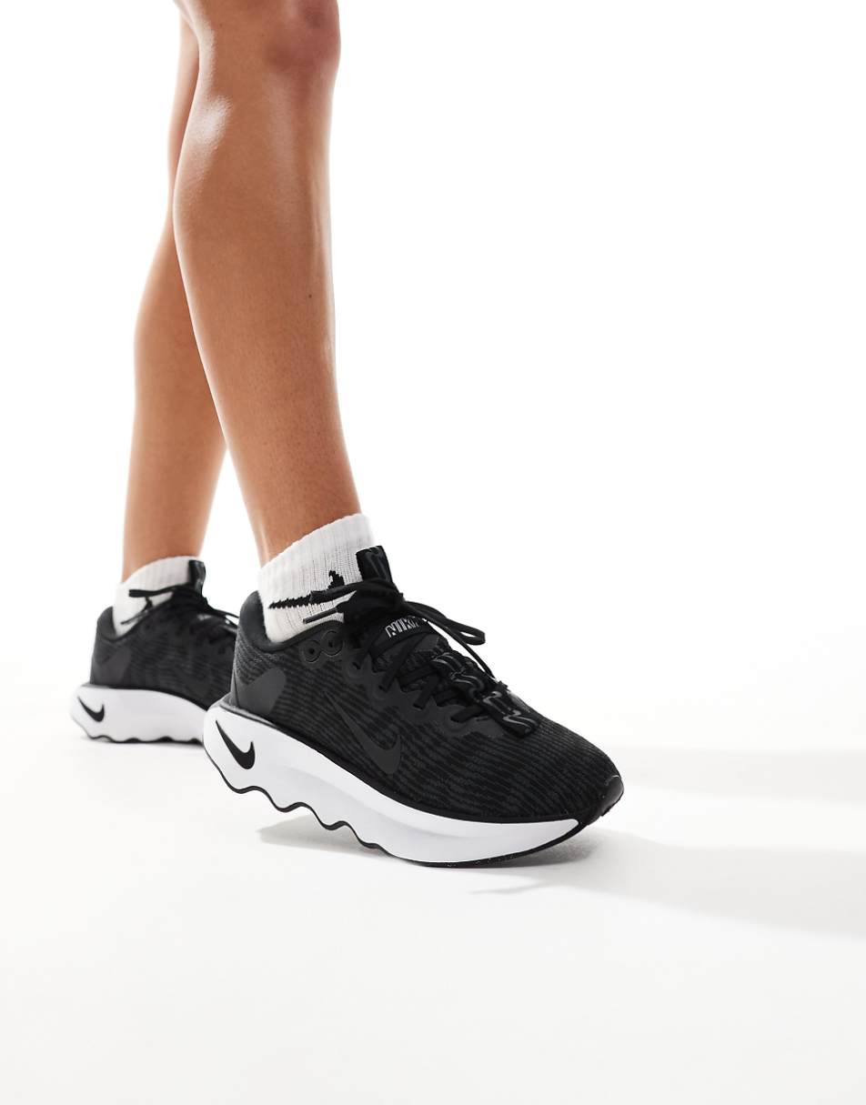 Nike Training Motiva sneakers in black and white