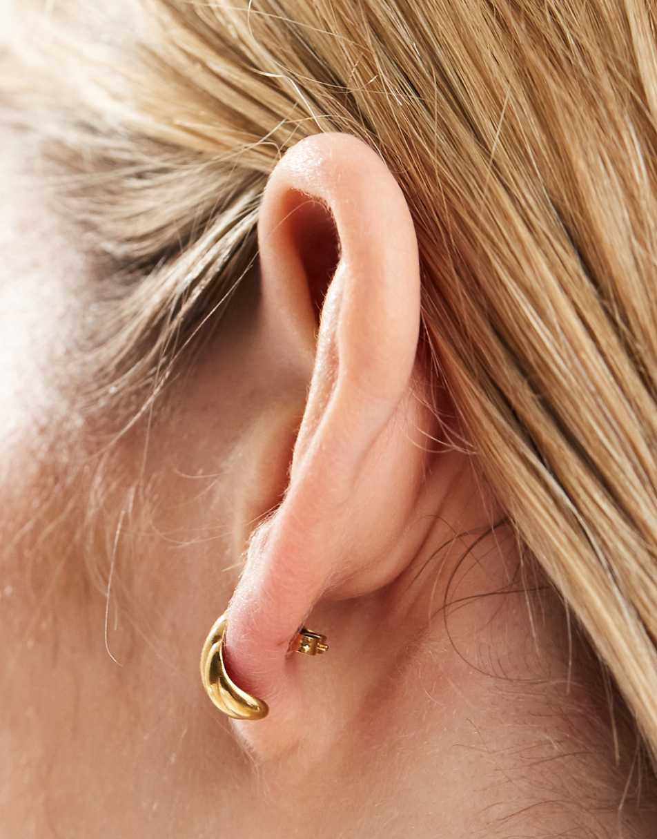 ASOS DESIGN waterproof stainless steel stud earrings with ridged curved design in gold tone