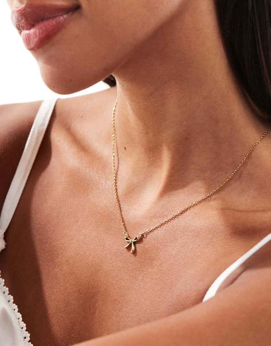 Lost Souls stainless steel bow pendant necklace in 18k gold plated