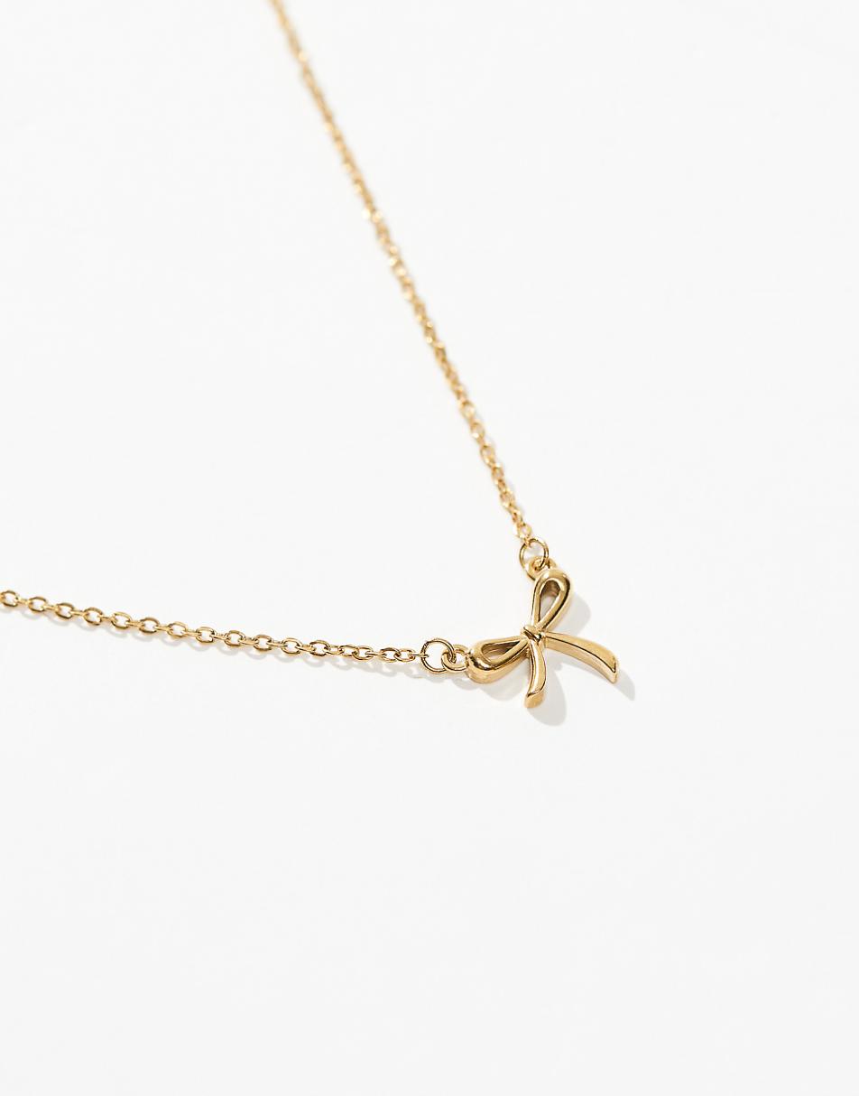 Lost Souls stainless steel bow pendant necklace in 18k gold plated