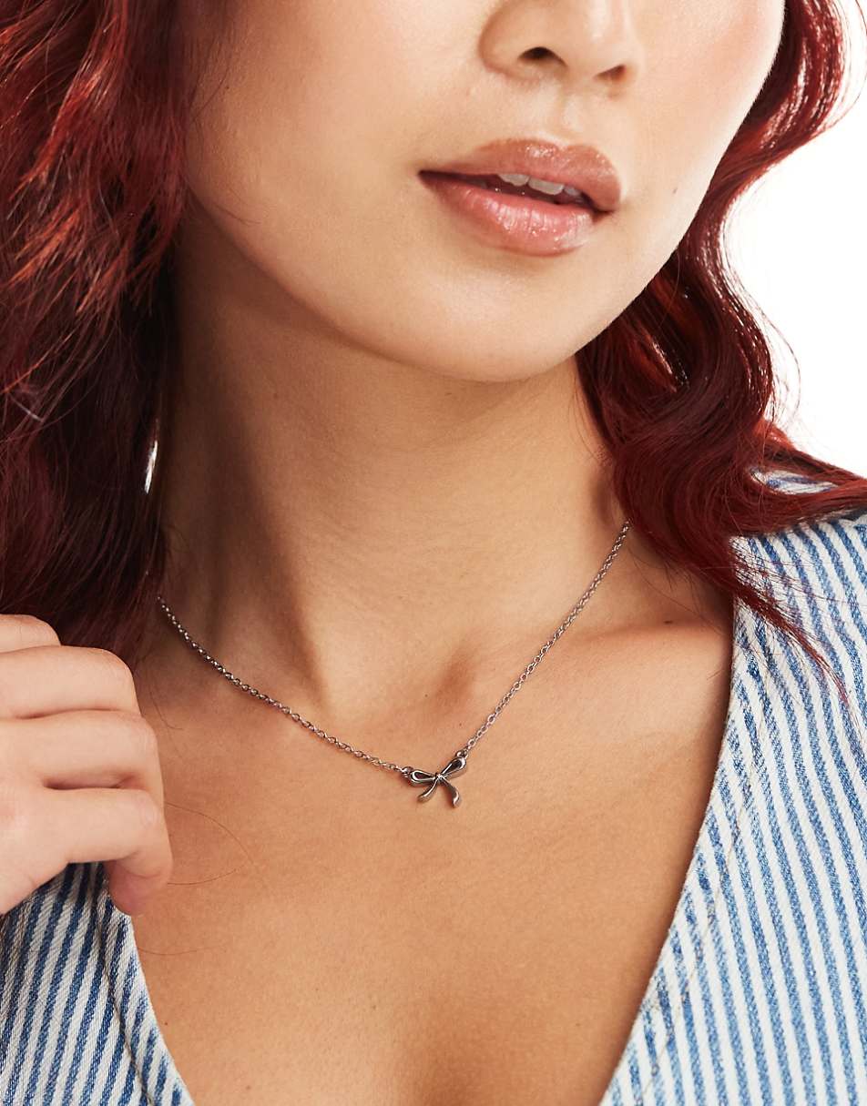 Lost Souls stainless steel bow pendant necklace in silver