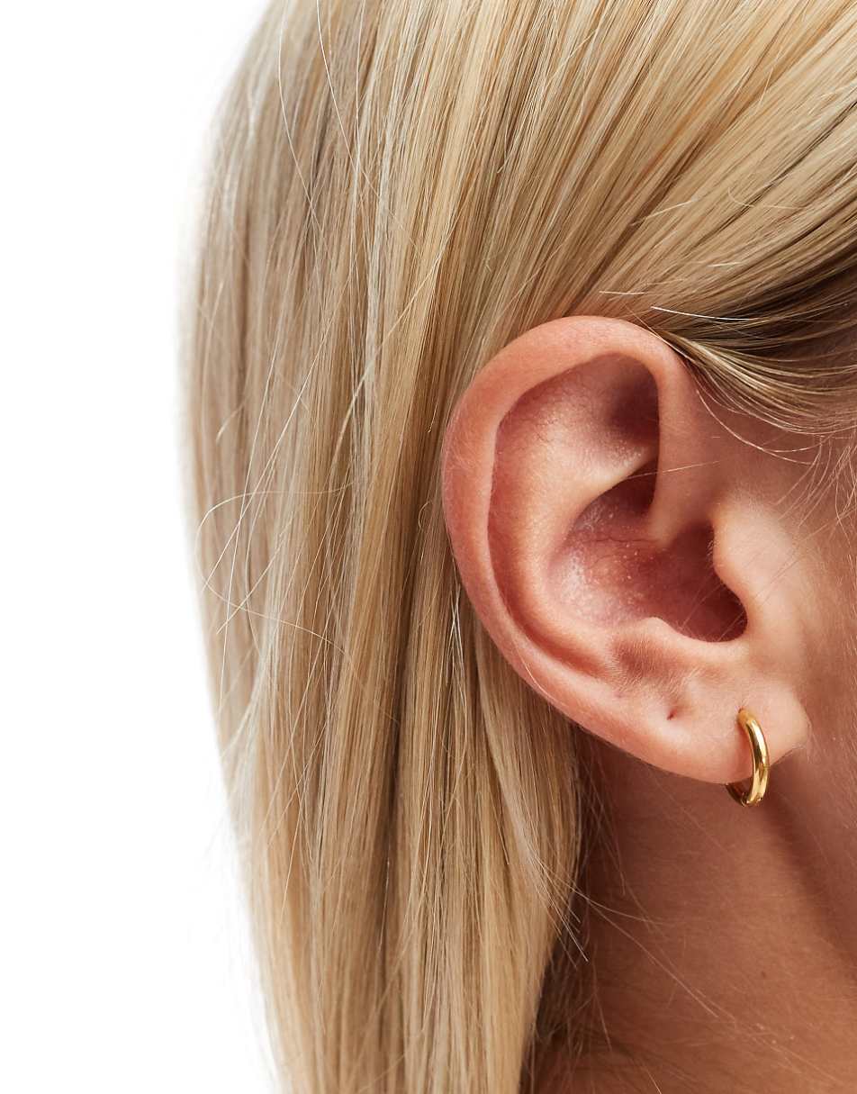 ASOS DESIGN waterproof stainless steel huggie hoop earrings in gold tone