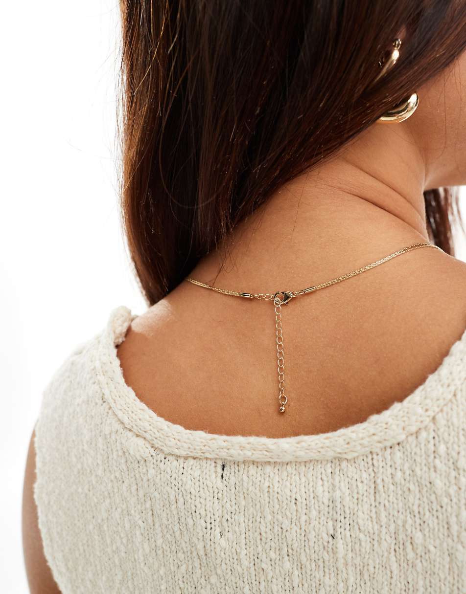 ASOS DESIGN lariat necklace with fine snake knot design in gold tone