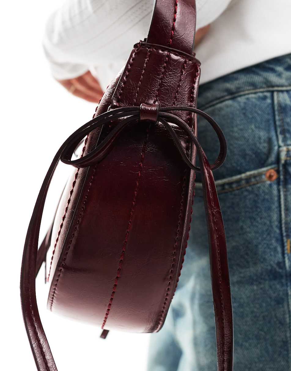 ASOS DESIGN half moon shoulder bag with side bow detail in burgundy