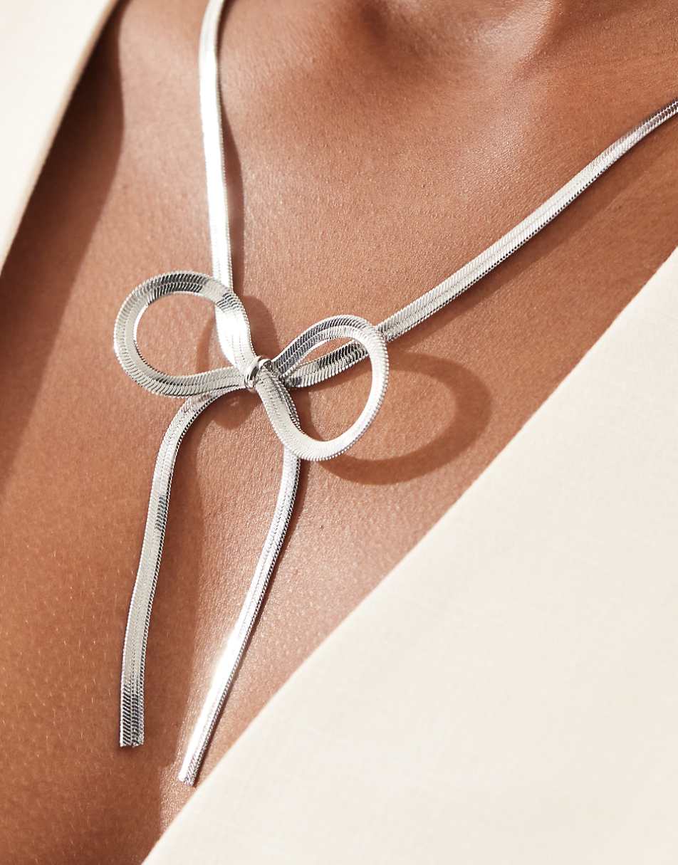 ASOS DESIGN necklace with snake chain bow detail in silver tone