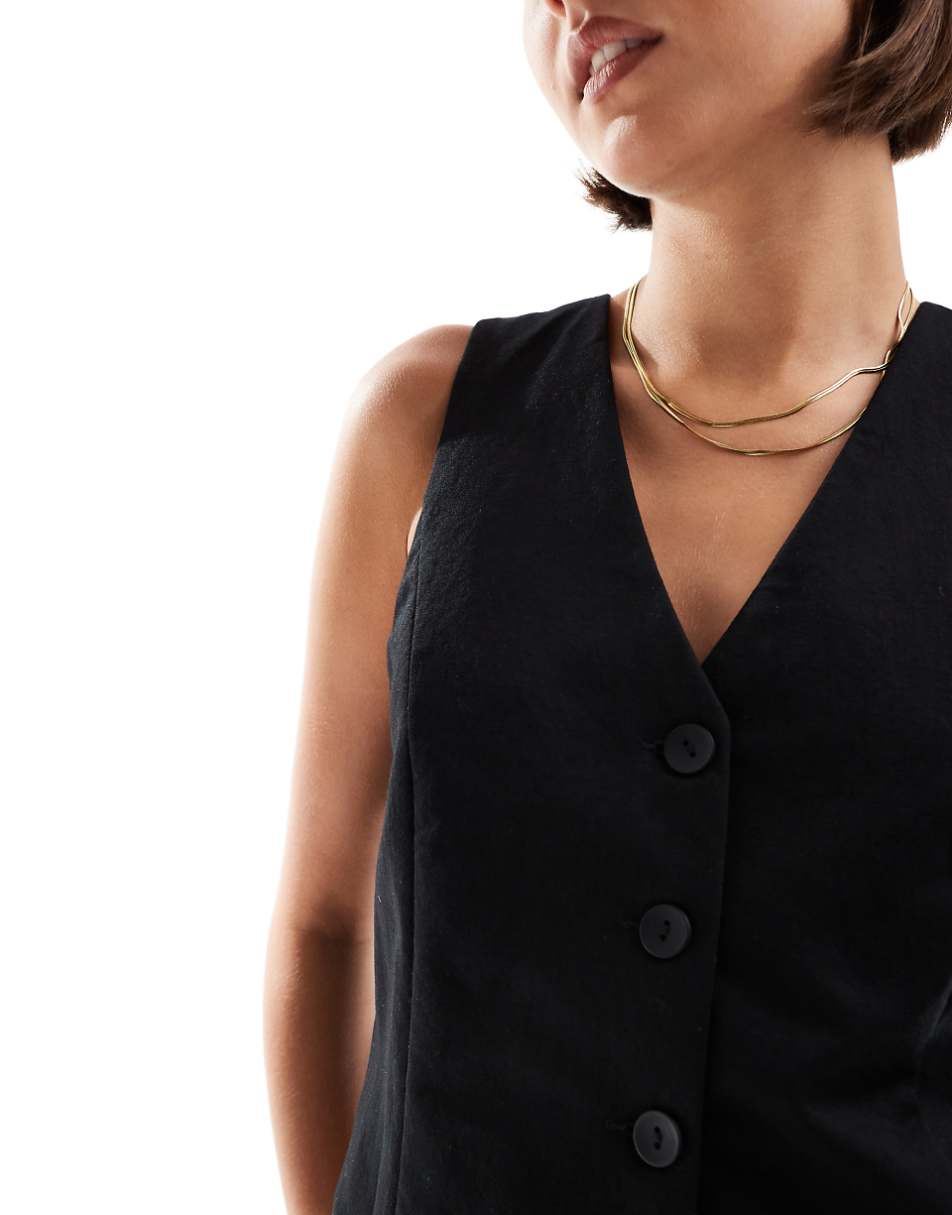 Mango button front vest in black