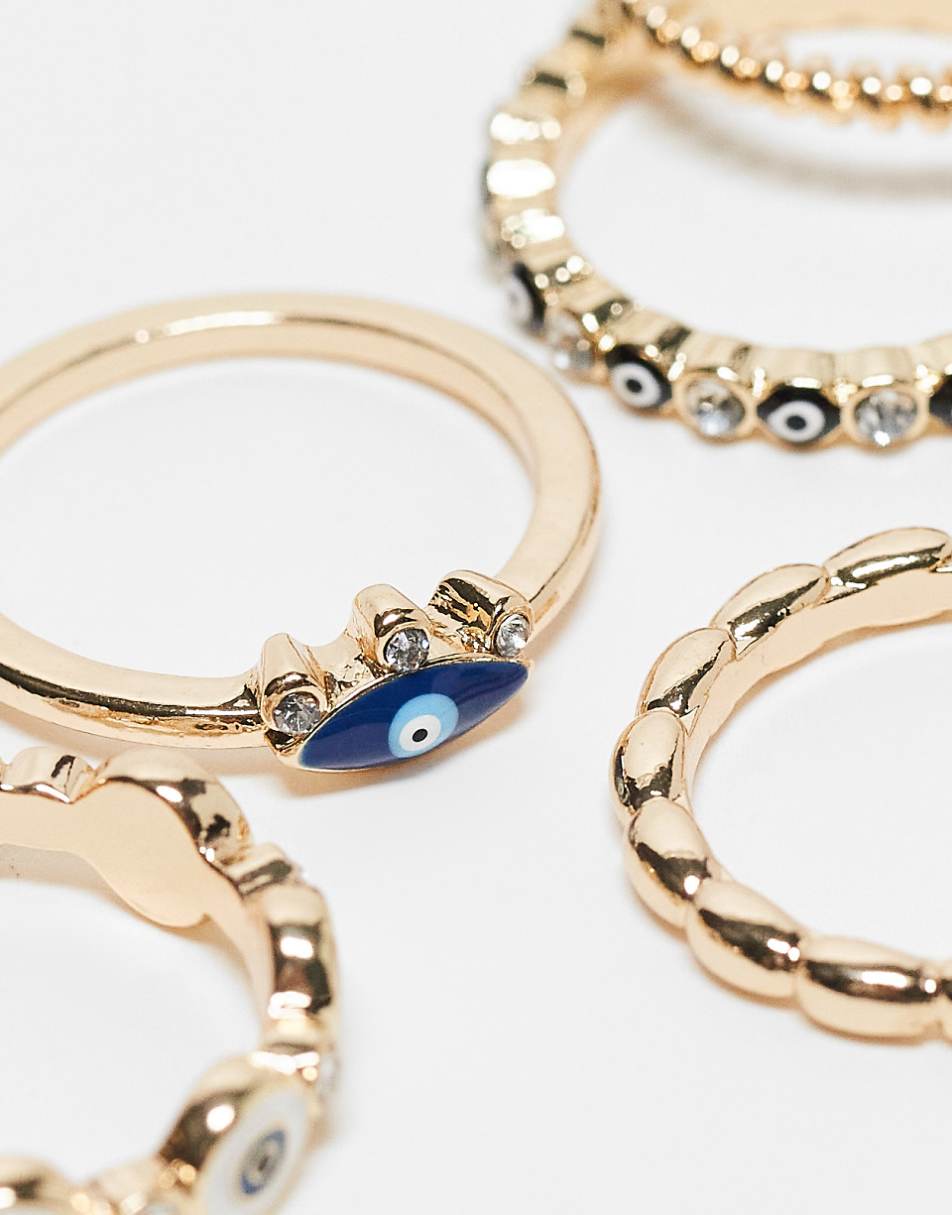 ASOS DESIGN Curve pack of 5 rings with mixed eye design in gold tone
