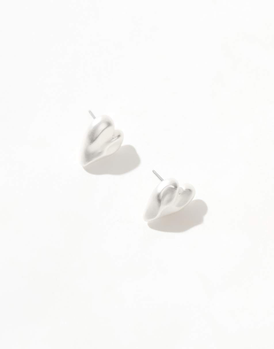 ASOS DESIGN stud earrings with molten heart detail in brushed silver