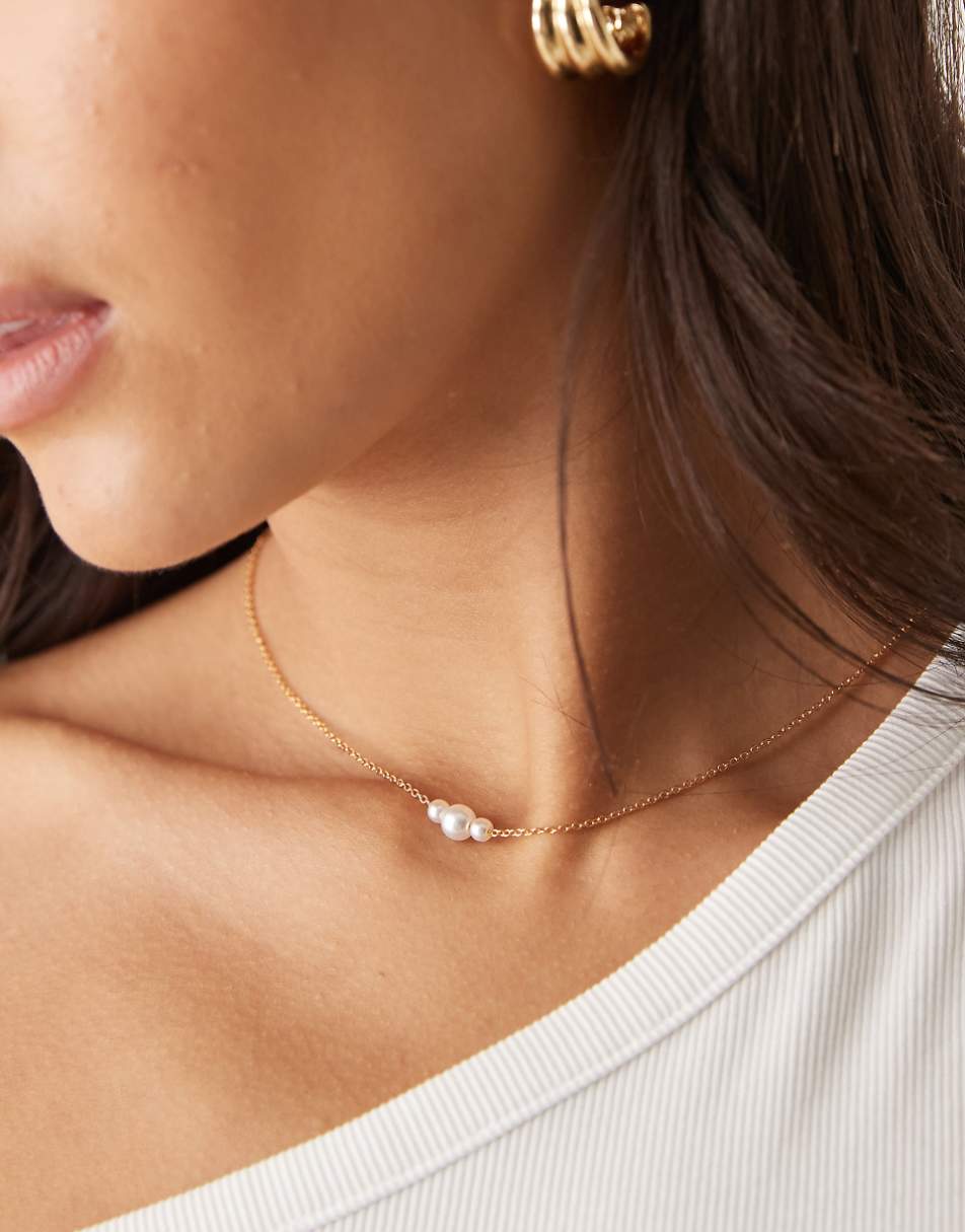 ASOS DESIGN stainless steel short necklace with faux pearl detail in gold tone