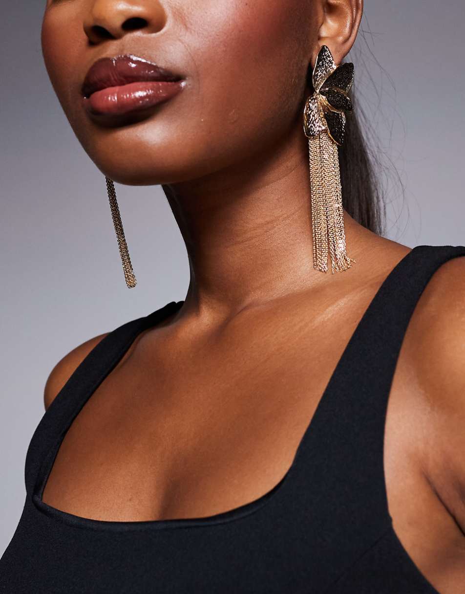 ASOS DESIGN drop earrings in textured petal design with chain tassels in gold tone