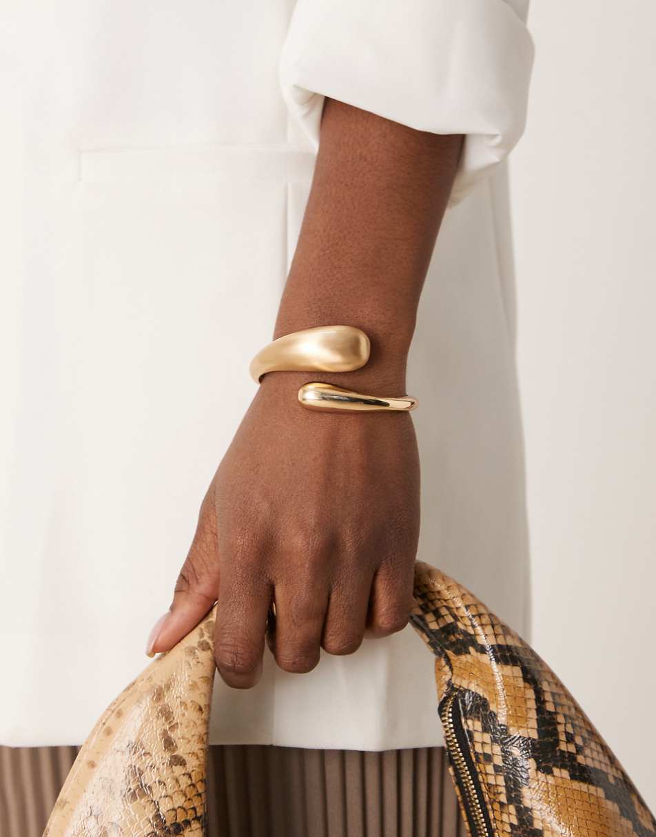 ASOS DESIGN cuff bracelet with wrap around molten detail with shiny and brushed gold tone