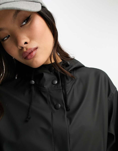 ASOS DESIGN Petite rubberized rain parka coat in black