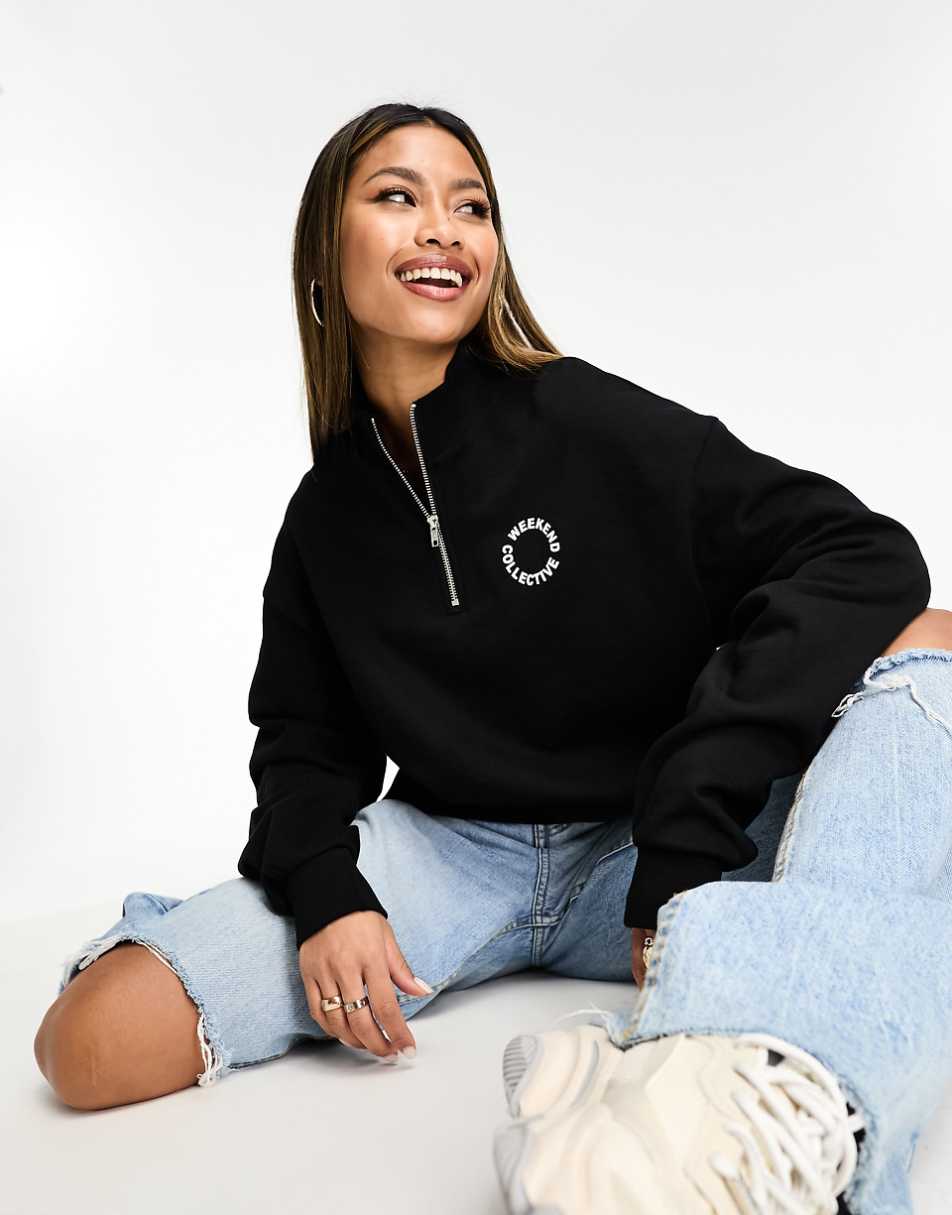 ASOS Weekend Collective half zip sweatshirt with circle logo in black