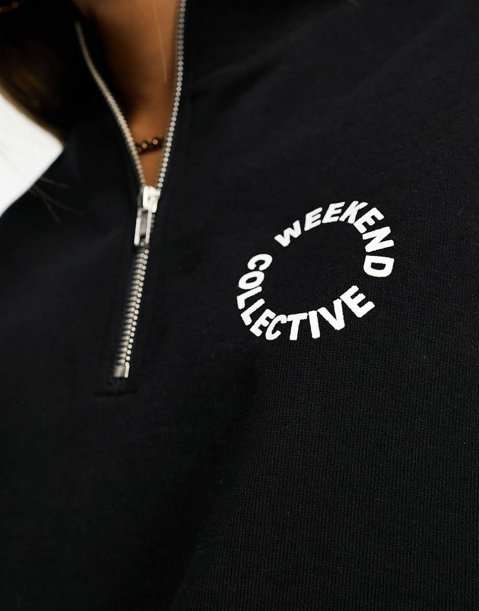 ASOS Weekend Collective half zip sweatshirt with circle logo in black