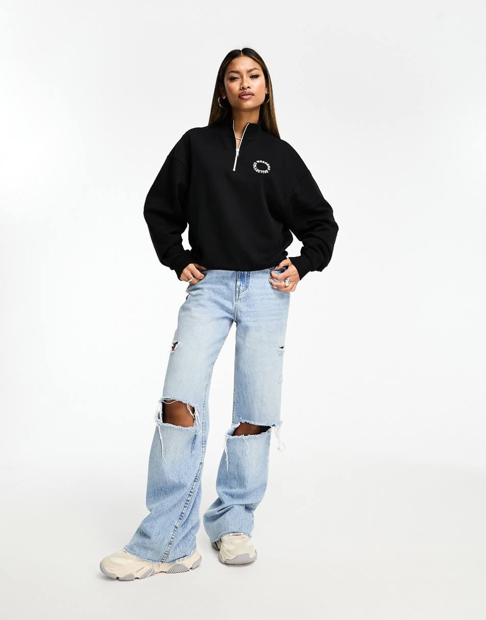 ASOS Weekend Collective half zip sweatshirt with circle logo in black