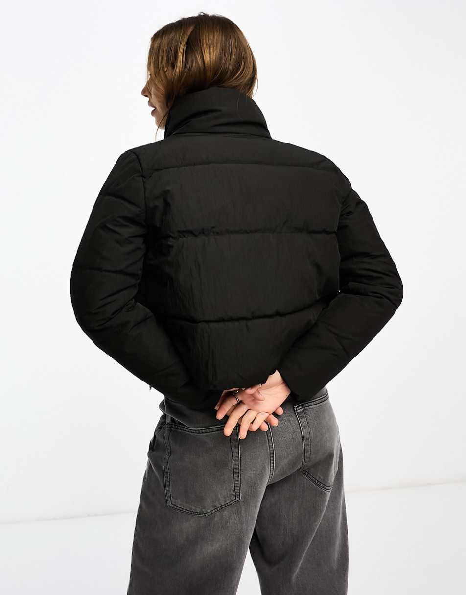 Only padded high neck jacket in black