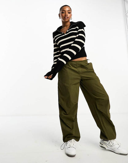 Monki high zip neck knit sweater in black and white stripe