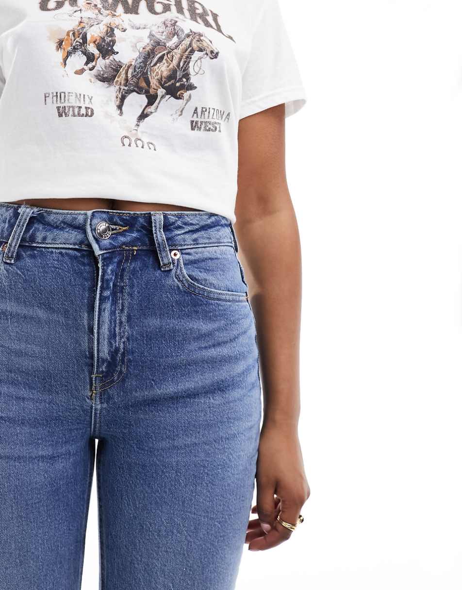 ASOS DESIGN flared jeans in mid blue