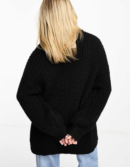 Monki high neck chunky rib knitted sweater with volume sleeve in black