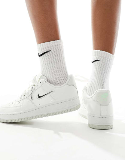 Nike Air Force 1 metallic sneakers in white