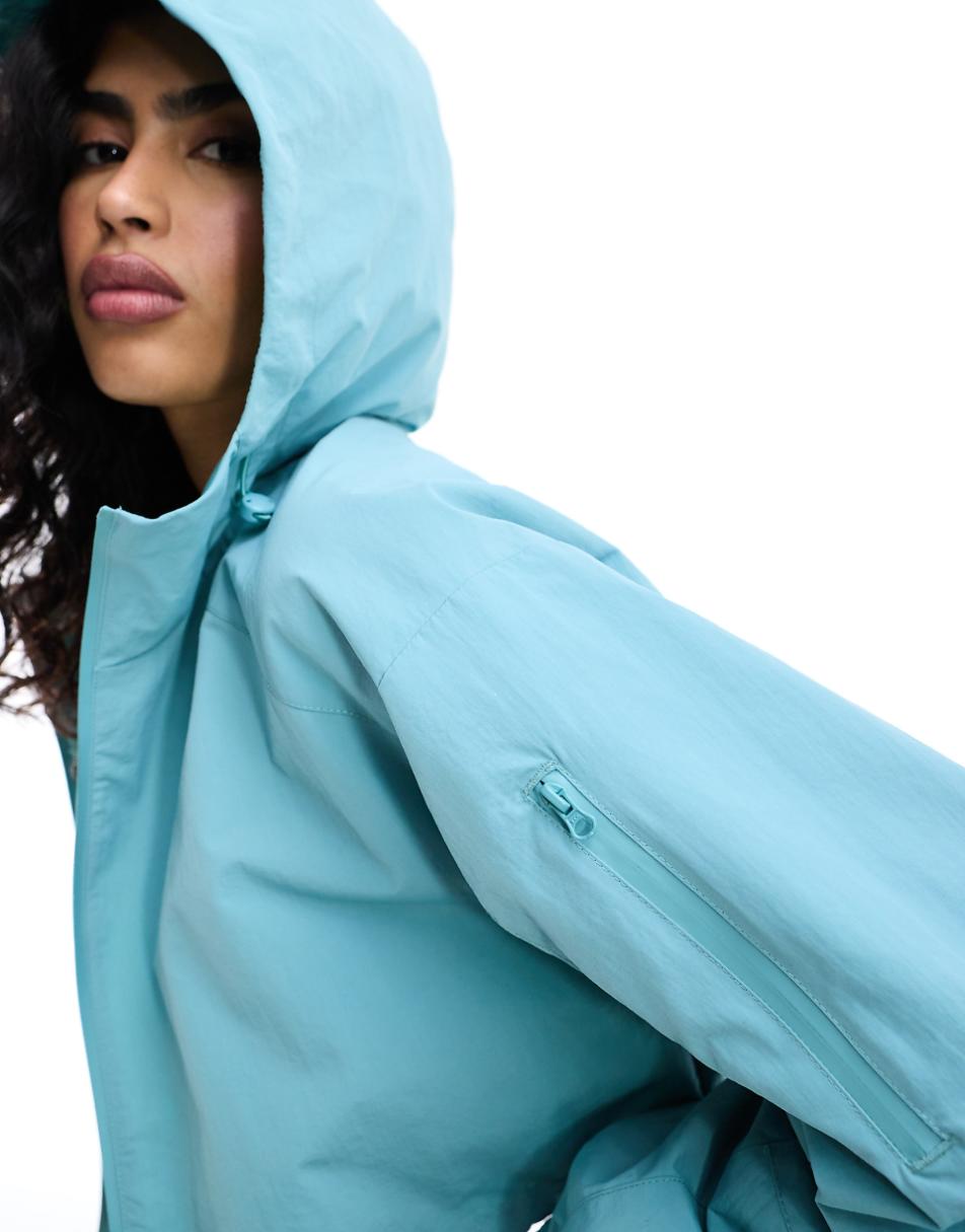 ASOS DESIGN cropped hooded rain jacket in blue