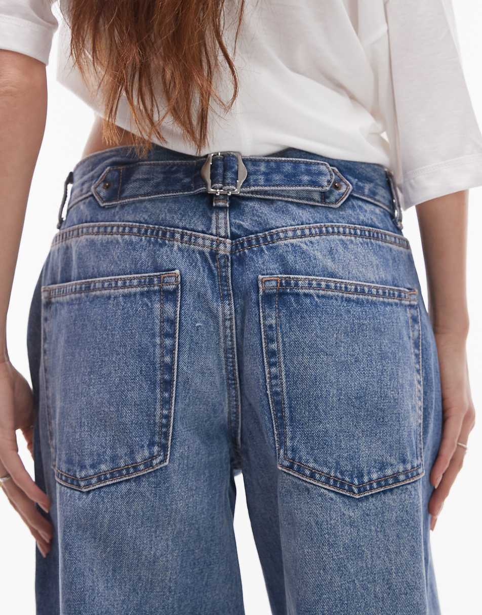 Topshop low rise Cinch back jeans in mid blue