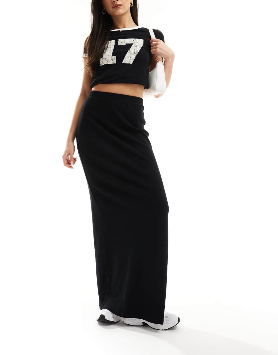 ASOS DESIGN Curve ribbed maxi skirt with side slit in black