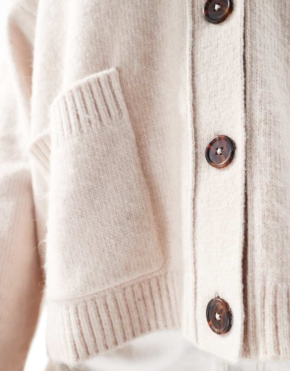 ASOS DESIGN Curve boxy cardigan with V-neck and pocket detail in cream