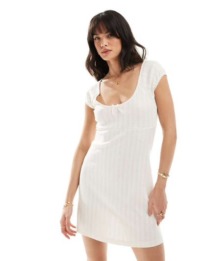 ASOS DESIGN scoop neck pointelle mini dress with bow detail in white