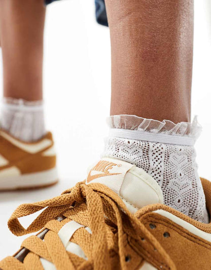 Nike Dunk Low sneakers in off white