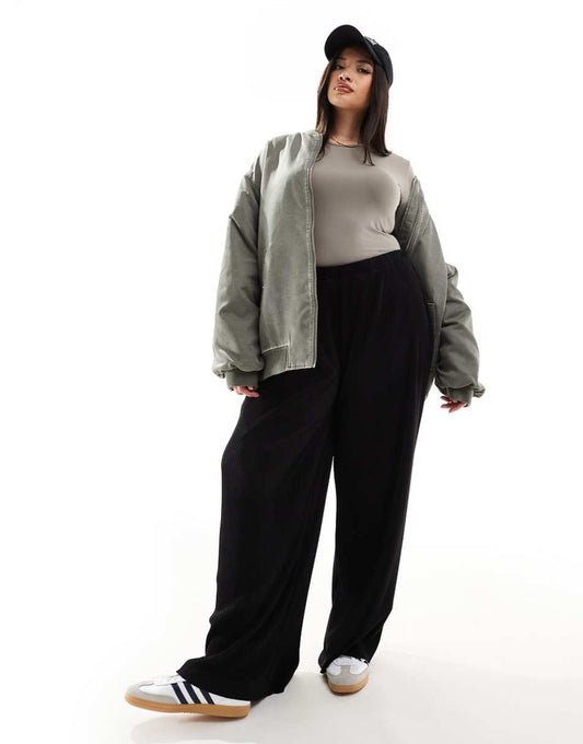 ASOS DESIGN Curve plisse wide leg pants in black