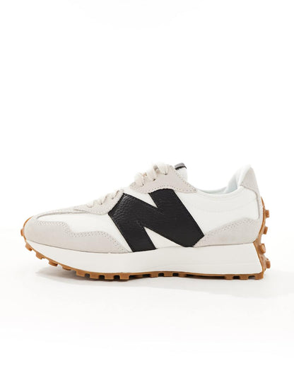 New Balance 327 gum sole sneakers in off white and black