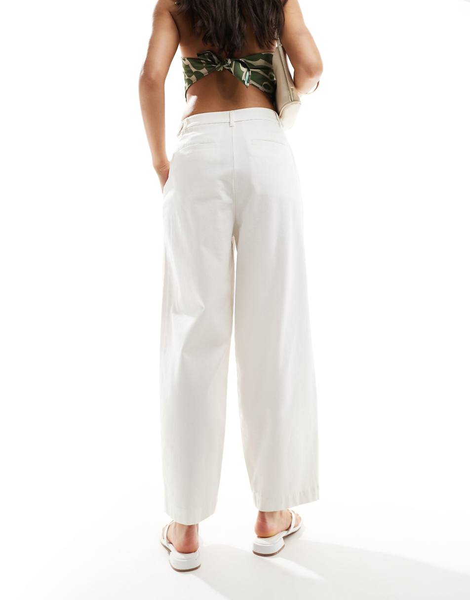 ASOS DESIGN barrel leg chino pants with button tab detail in white