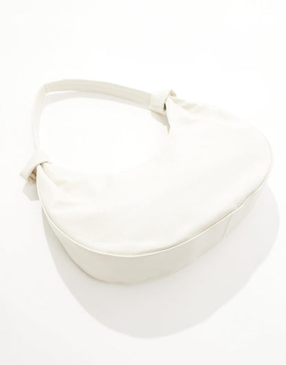 Glamorous knotted oversized shoulder bag in cream patent