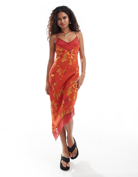 Reclaimed Vintage asymmetric hem cami midi slip dress in orange floral print