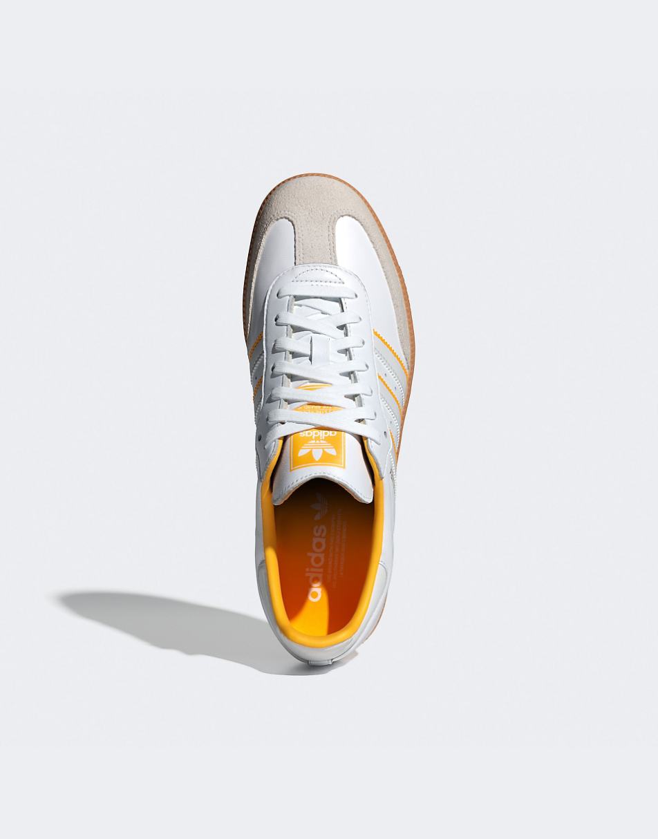 adidas Originals Samba OG sneakers in white with yellow stripes