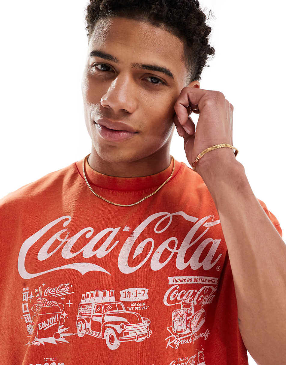 ASOS DESIGN unisex oversized licensed T-shirt with Coca-Cola graphic front print in washed red