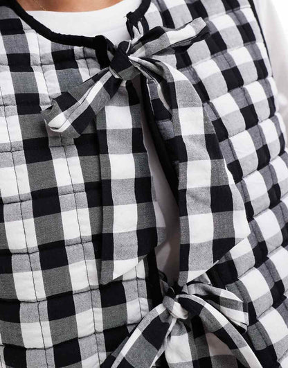 ASOS DESIGN quilted vest with bows in mono gingham