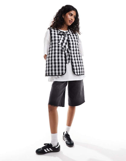 ASOS DESIGN quilted vest with bows in mono gingham