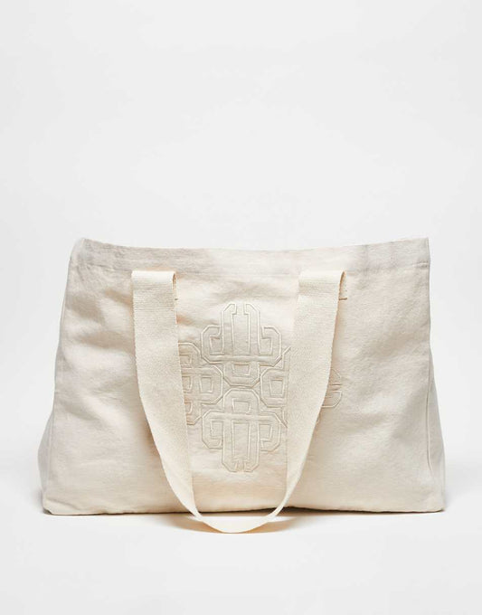 The Couture Club emblem logo tote bag in off white