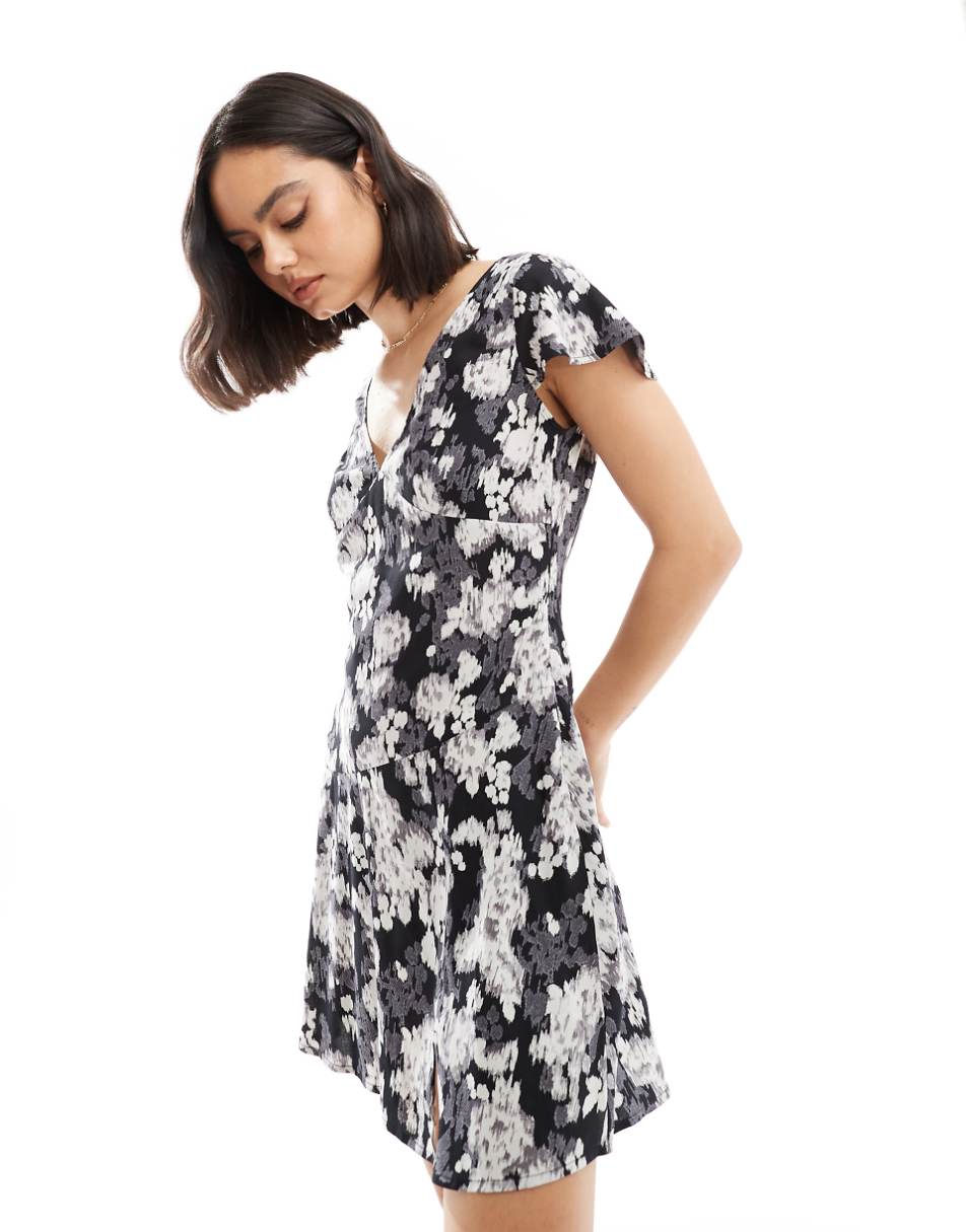 ASOS DESIGN v neck flutter sleeve mini tea dress in black and white blurred floral print