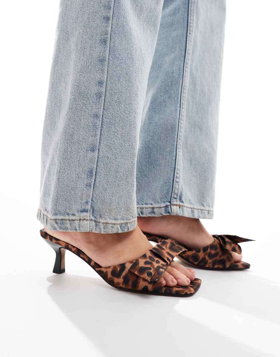 ASOS DESIGN Hyphen bow detail mid heeled mules in leopard