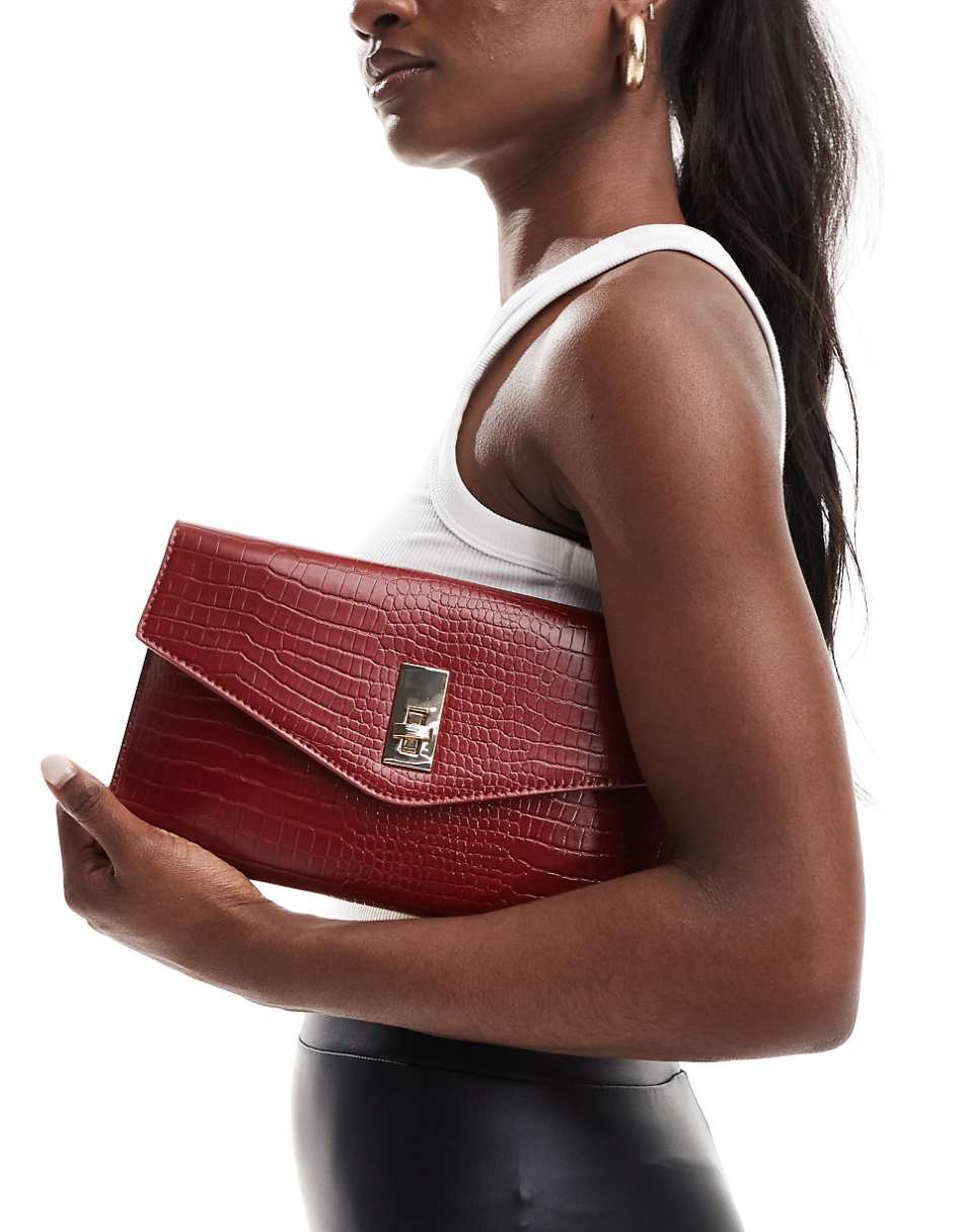 True Decadence classic clutch bag in deep red