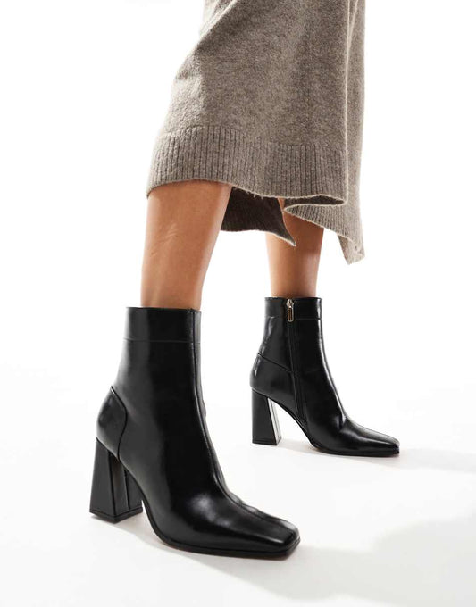 ASOS DESIGN Everest flared heel boots in black