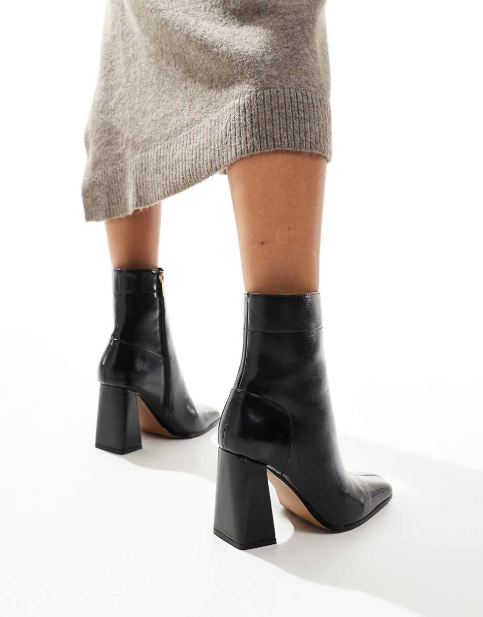 ASOS DESIGN Everest flared heel boots in black